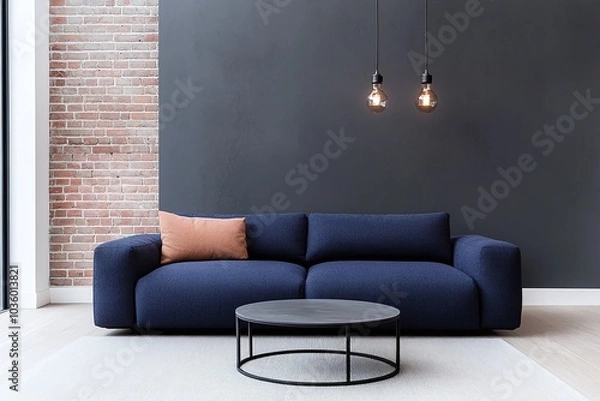 Fototapeta Contemporary living room with navy blue sofa, round black coffee table, pink accent pillow, exposed brick and dark accent wall, pendant lights, modern design, minimalistic decor, copy space

