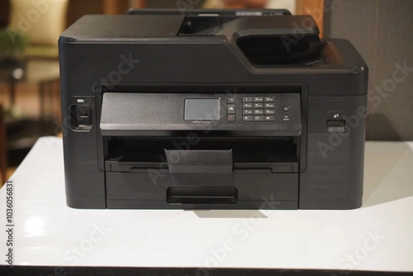 Fototapeta front view, antique black plastic printer on white table, office background, technology, object, office, decor, comfortable, business, copy space