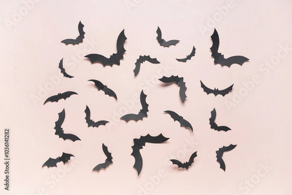 Fototapeta Paper bats for Halloween party on pink background