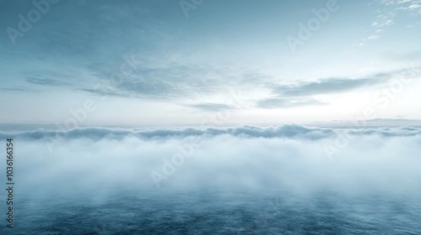 Fototapeta A panoramic view of a vast expanse of clouds stretching across the horizon with a soft, blue hue under a clear sky.