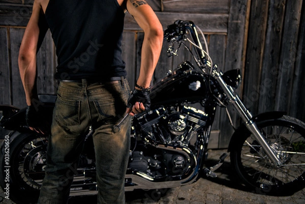 Obraz Young man with wrench, ready to repair his bike