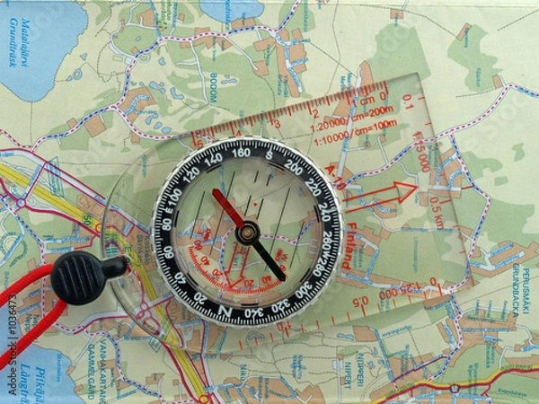 Obraz orienteering compass on a map