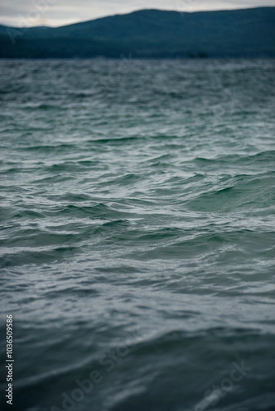 Fototapeta Textural waves at sunset in the sea