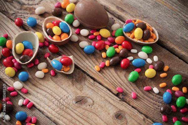 Fototapeta Chocolate Easter Eggs Over Wooden Background