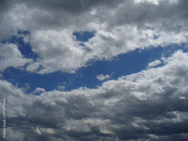 Fototapeta Eyes and face smiling in sky with clouds - natural arrangement of clouds in blue sky. Topics: weather, meteorology, atmosphere, air space, season, optimism, cheerfulness
