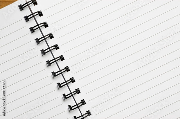 Obraz Spiral notebook, with lined sheets, close up shot.