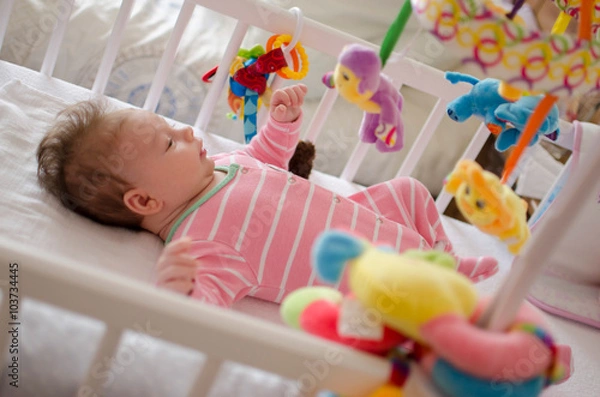 Obraz baby in a cot