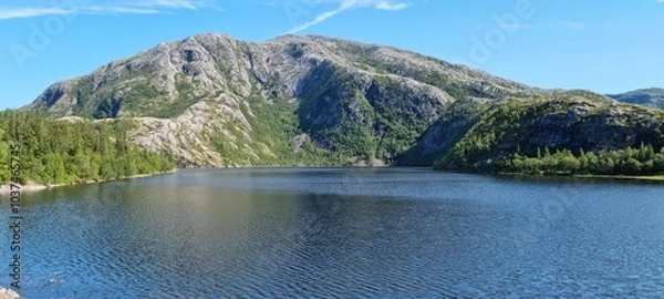 Fototapeta serene fresh water lake in summertime in northern Norway