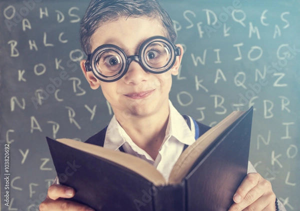 Obraz Funny nerdy school boy in classroom