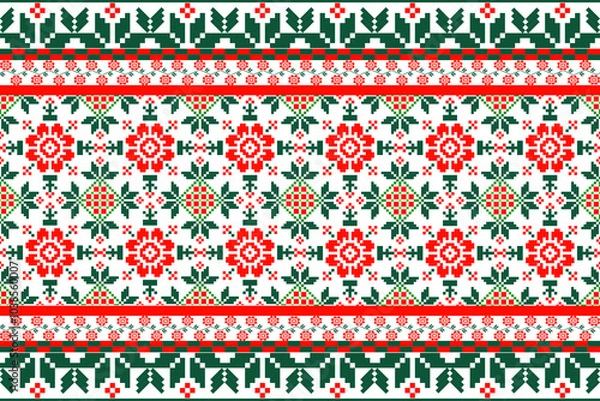 Fototapeta christmas pattern ,a traditional textile design, with a prominent red and green floral pattern on a white background. The motifs are symmetrical, resembling cross-stitch or embroidery,