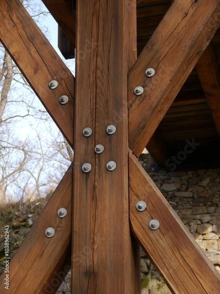 Fototapeta Wooden bridge beautiful structure over a ravine in the forest.