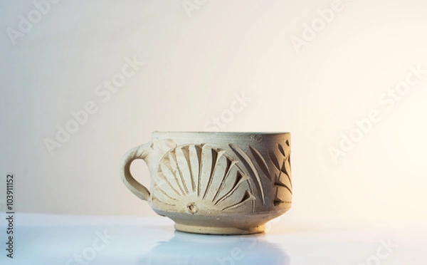 Fototapeta hademade clay cup isolated on white background