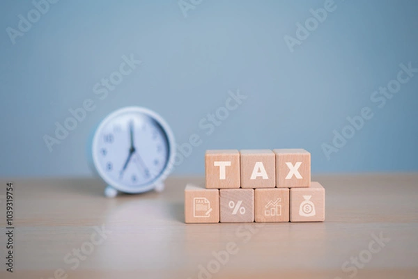 Obraz Tax icon in the wooden cube for income tax return and submit tax for payment tax documents online.