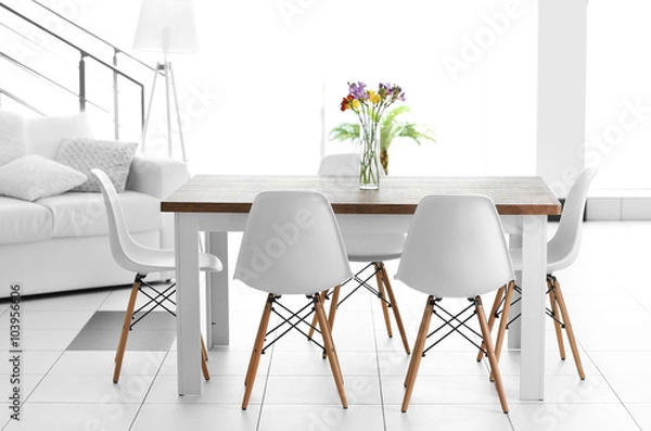 Fototapeta Beautiful comfortable modern interior with table and chairs