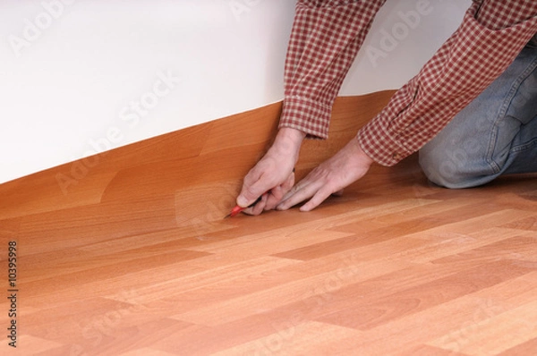 Obraz floormaker making a linoleum floor