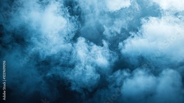 Obraz Mysterious blue smoke swirling gracefully in the dim light evokes a sense of tranquility and intrigue during a calm evening
