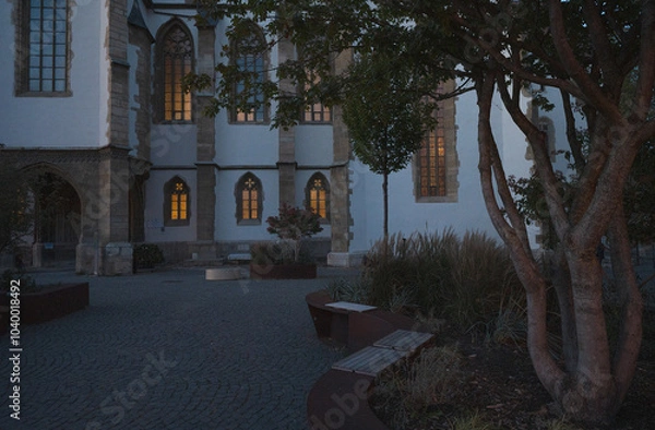 Obraz Church windows lightened  in the park blue hour.
