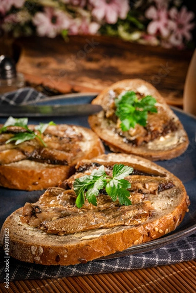Fototapeta Slices of multigrain bread with sprats.