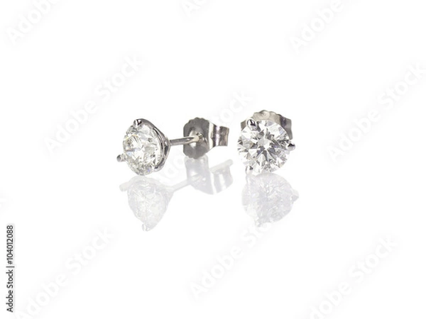 Obraz Diamond stud fine jewelry round brilliant pierced earrings isolated on white with a reflection
