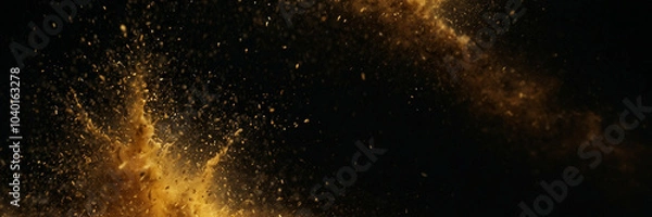 Fototapeta Abstract view of shimmering gold dust scattered against a black background