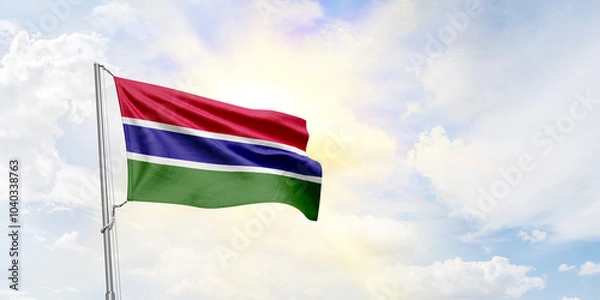 Fototapeta Gambia flag waving on sky background. 3D Rendering