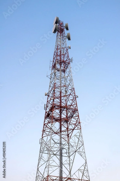 Obraz Telecommunications tower with clear blue sky.