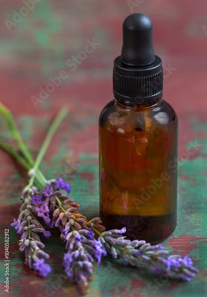 Fototapeta lavender essential oil for better good health. Calming relaxing aromatherapy concept. flower on top of the bottle