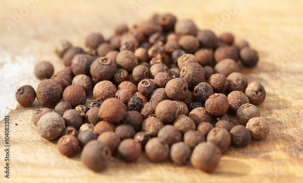 Obraz Black pepper on wooden background