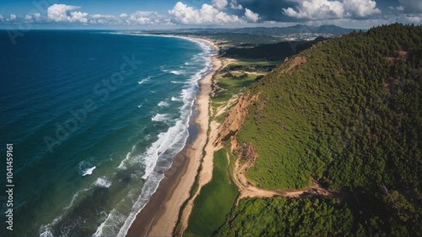 Fototapeta A breathtaking landscape with rugged cliffs, a winding river, lush green valleys, and distant ocean view under a partly cloudy sky.