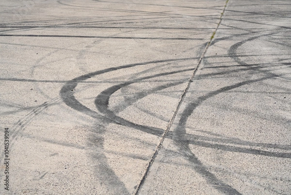Fototapeta multiple tyre skid marks on concrete surface