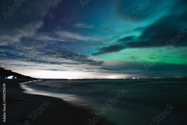 Fototapeta aurora borealis, northern lights above baltic sea in poland, stegna, october 2024