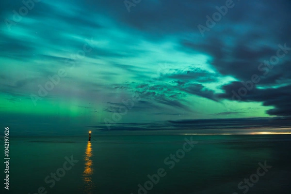 Fototapeta aurora borealis, northern lights above baltic sea in poland, stegna, october 2024