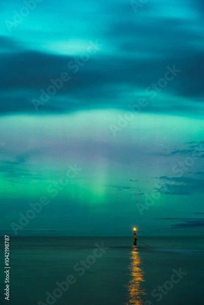 Fototapeta aurora borealis, northern lights above baltic sea in poland, stegna, october 2024