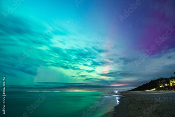 Fototapeta aurora borealis, northern lights above baltic sea in poland, stegna, october 2024
