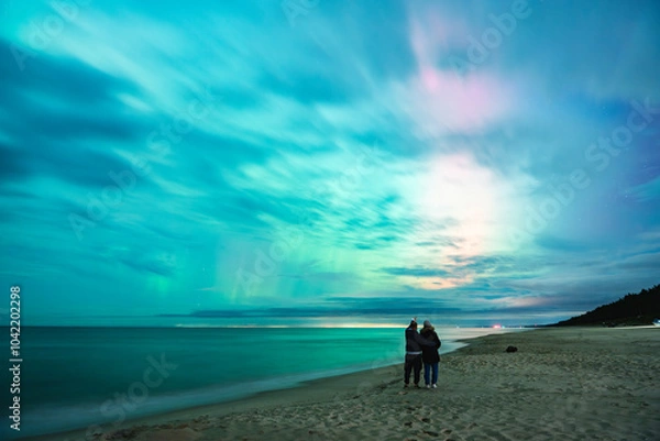 Fototapeta aurora borealis, northern lights above baltic sea in poland, stegna, october 2024