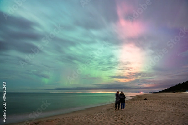 Fototapeta aurora borealis, northern lights above baltic sea in poland, stegna, october 2024