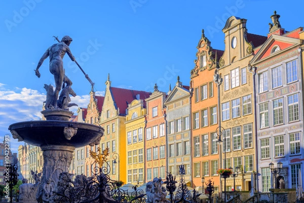 Fototapeta Neptune statue with colorful houses in background, Gdansk, Polan