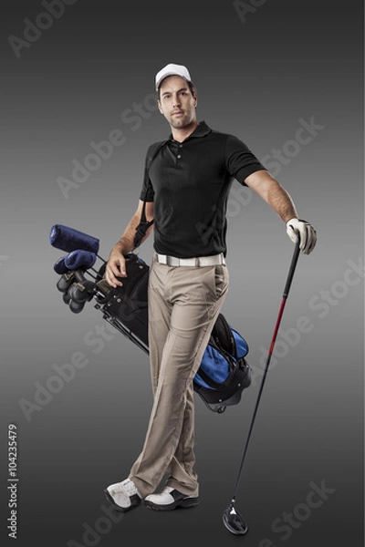 Fototapeta Golf Player using a black uniform.