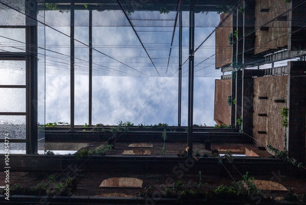 Obraz A view on the sky through the building