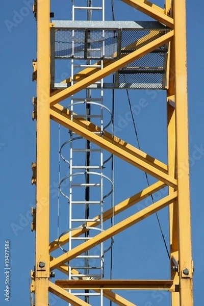 Fototapeta Détail d'une grue jaune sur un chantier de constrction