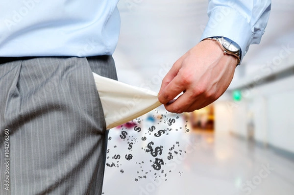 Fototapeta Man pulls out empty pockets