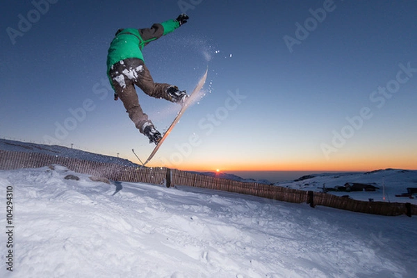 Fototapeta Snowboarding in the mountains