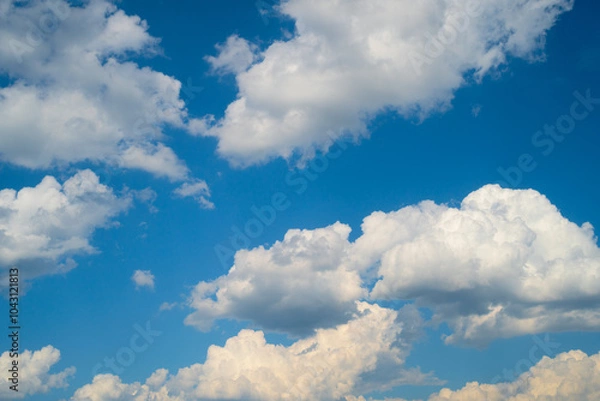 Obraz White clouds on a clear blue sky