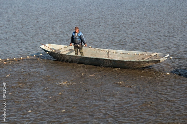 Obraz Fisherman Pulling Fishing Net