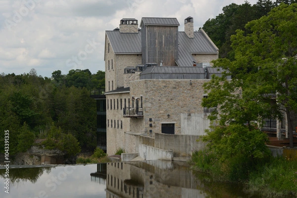 Fototapeta Elora grist Mill. Originally built in the 19th century above the thundering falls of the Grand River and Elora Gorge 