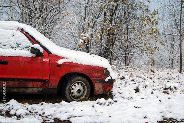 Fototapeta Abandoned car standing by the road. Maybe after the traffic accident or failure. Symbolises also the dangerous conditions in winter with ice, snow and snatch.