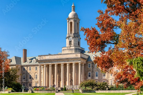 Fototapeta The Old Main building on the campus of Penn State University in autumn sunny day, State College, Pennsylvania.