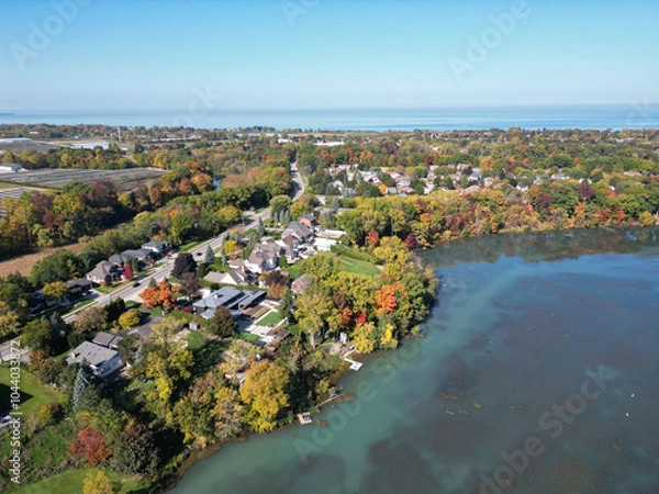 Obraz Aerial over Martindale Pond near Henley Island viewing north towards Port Dalhousie and Lake Ontario in St. Catharines, Ontario, Canada on a sunny Autumn day in October, 2024.