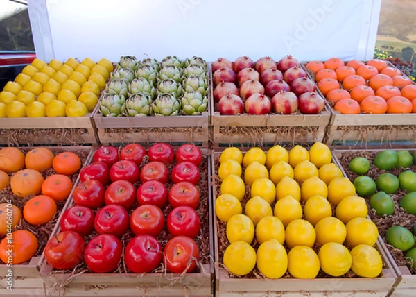 Fototapeta Fresh produce, fruits and vegetables, in display crates on the back of a truck for sale at a farmers market