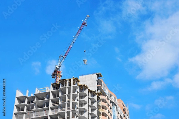Fototapeta Crane lifting cement mixing container